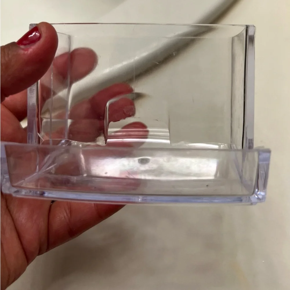 Clear cotton swab holder.